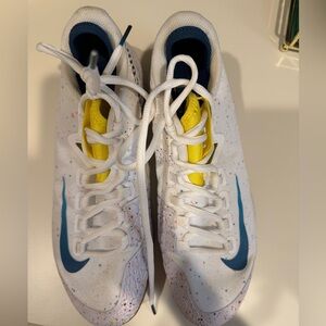Nike White Athletic Shoes with Blue Swoosh and Yellow Tongue